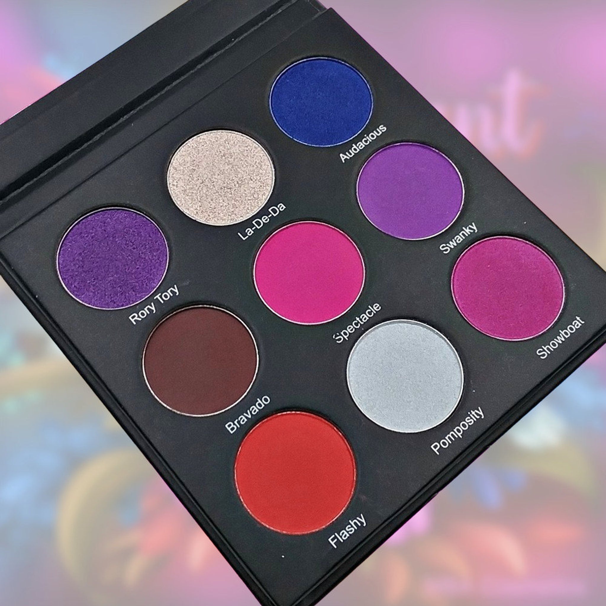 Side view of Flamboyant Eyeshadow Palette showcasing vibrant matte and shimmer shades in rectangular pans