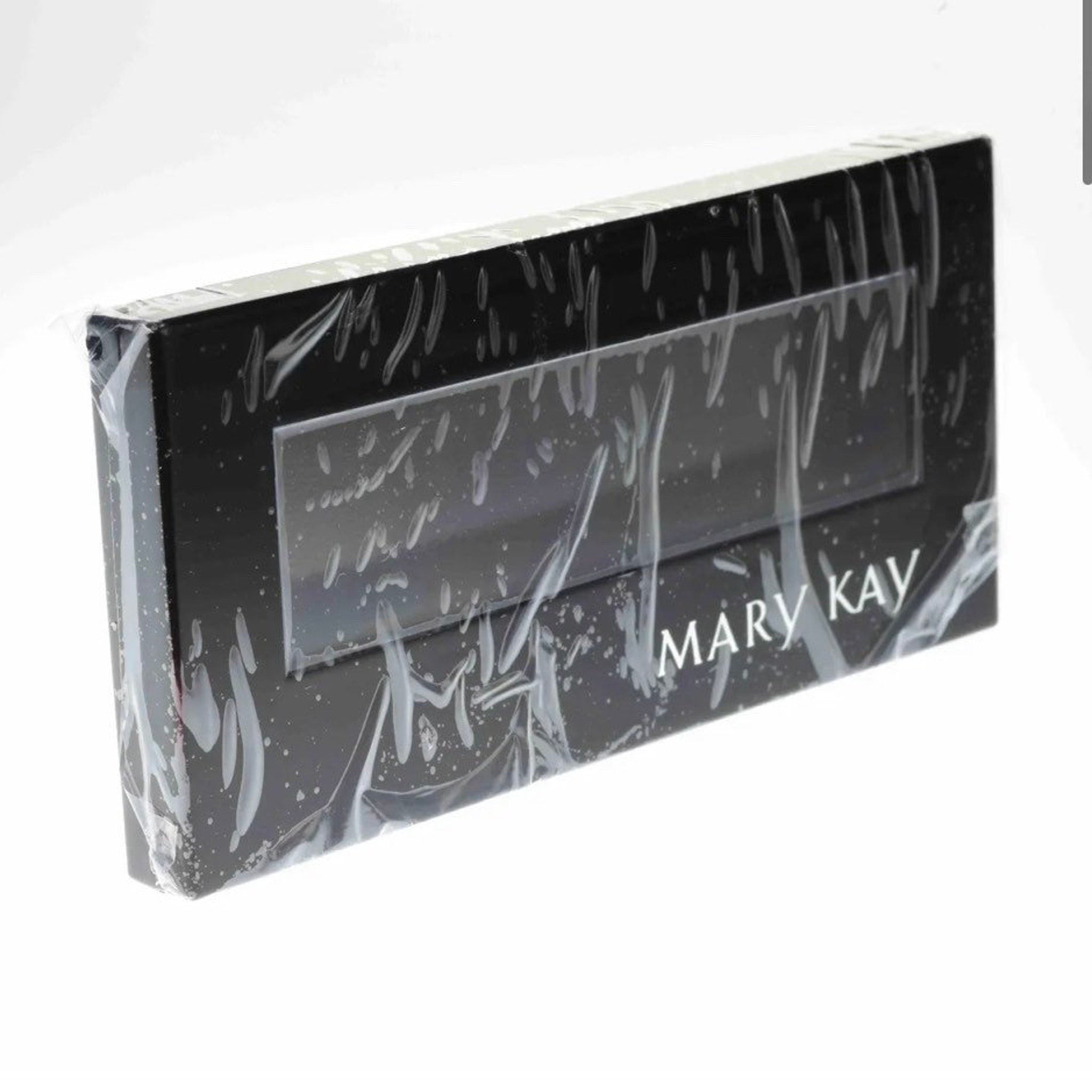 Close-up of Mary Kay Petite Eyeshadow Palette showing six matte and shimmer powder shades in neutral tones