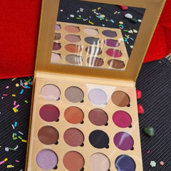 Close-up of mocha eyeshadow palette showing shimmering bronze and matte brown shades in rectangular pans