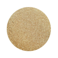 Close-up of vegan light gold shimmer pressed pigment in round 26mm pan with metallic finish