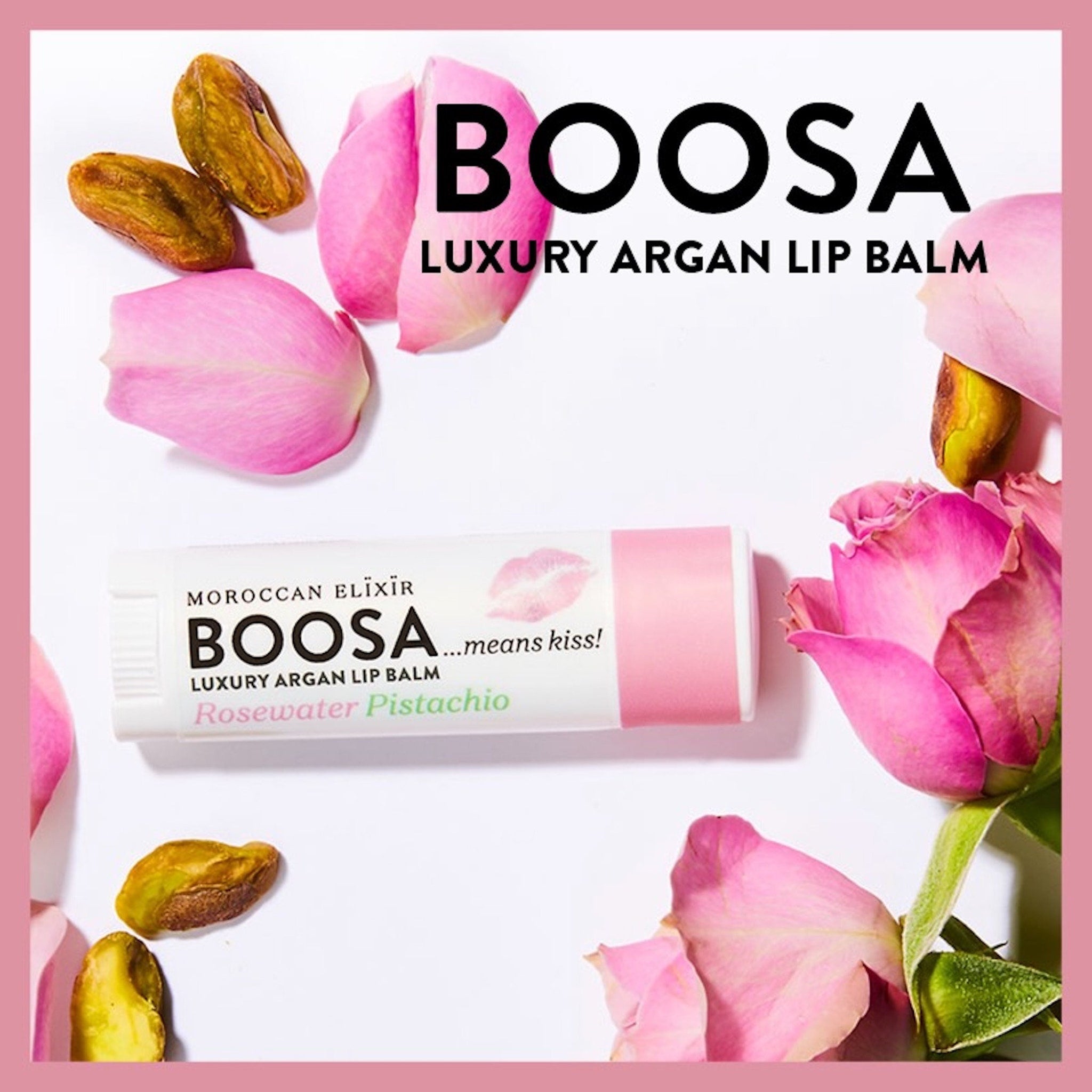 Lip balm tube with BOOSA branding, pink and white, with rose petals and pistachios