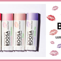 Lip balm tubes in white, pink, and purple with BOOSA brand text and kiss print