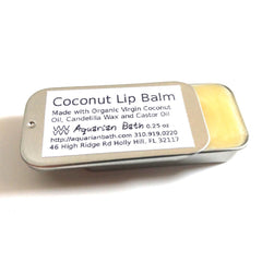 Coconut lip balm in metal tin with yellow balm, Aquarian Bath label visible