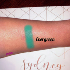 Side view of evergreen matte eyeshadow pan showing pressed powder texture and 26mm circular compact