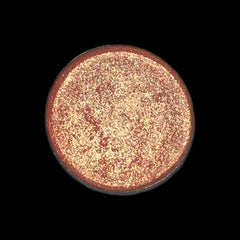 Side view of peachy pink talc-free vegan eye shadow compact showing smooth matte texture and minimalist packaging