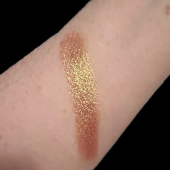 Eyeshadow swatch, gold shimmer, brown undertones, applied on skin