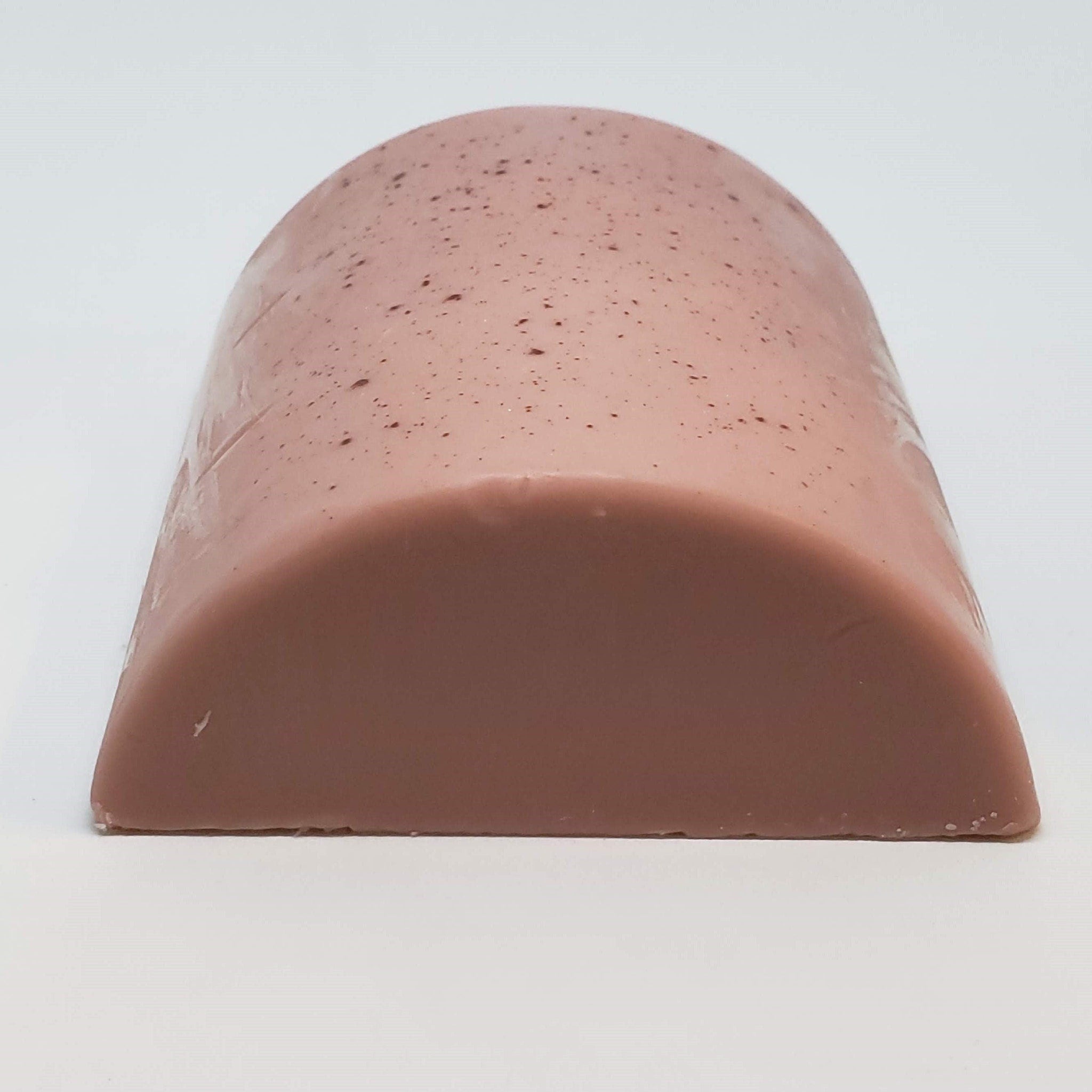 Pinkish-brown loaf with speckled surface and smooth texture, cut in half