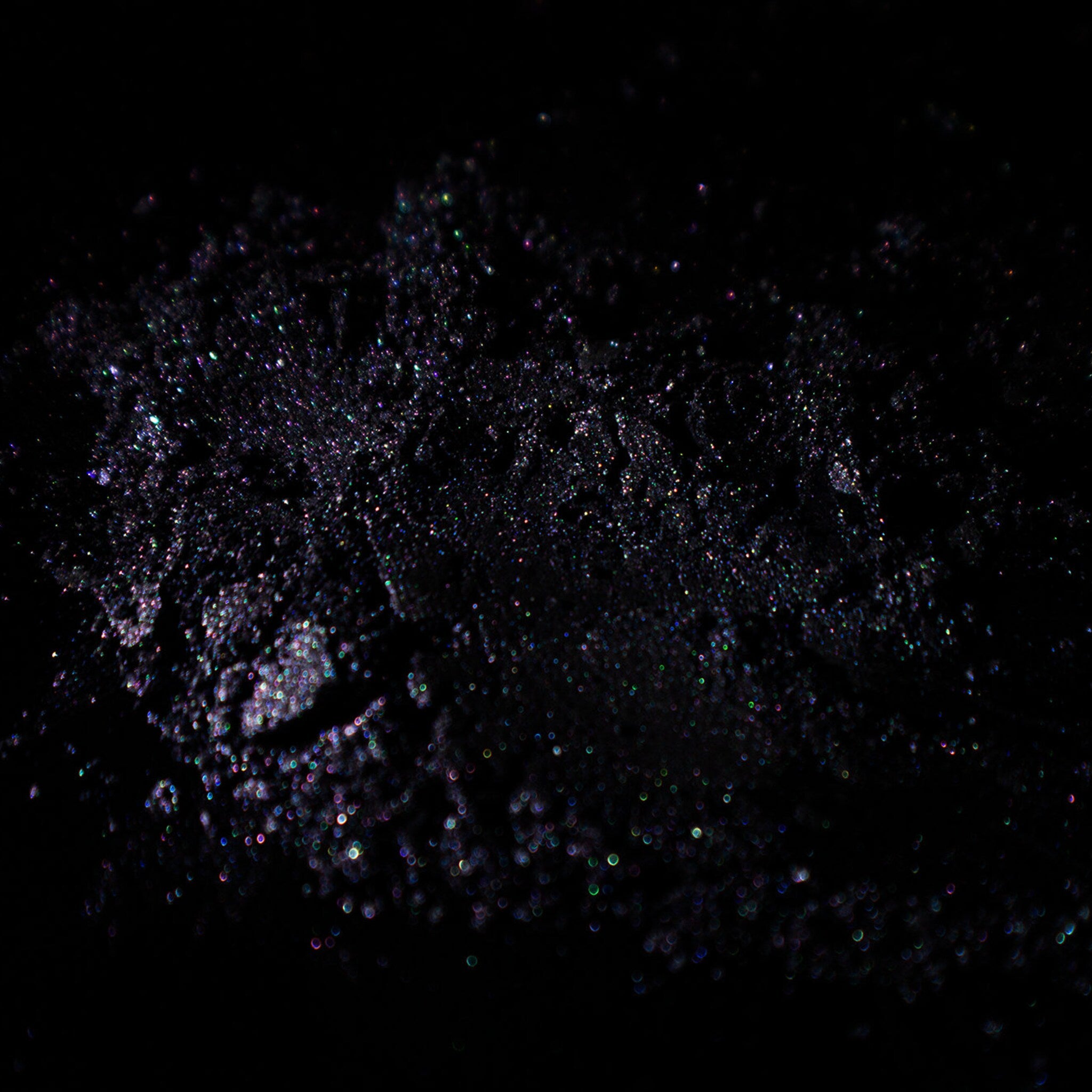 Side view of Grungy Blue to Purple Duochrome Eyeshadow pan showing shimmer shift in natural light