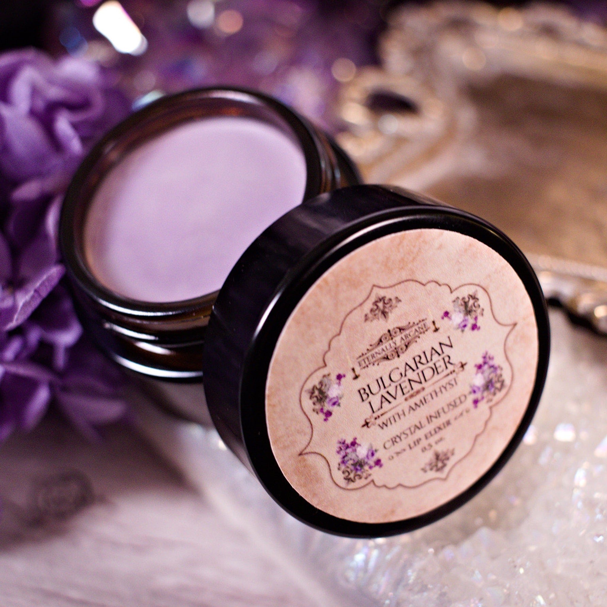 Lip balm jar with lavender-colored cream, brown glass, and a black lid with label text "Bulgarian Lavender