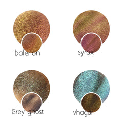 Hand applying shimmering grey multichrome eyeshadow with magical color shift to eyelid