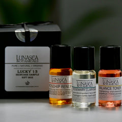 Skincare sample set with black box, three glass bottles, and Lunasea Botanicals branding visible