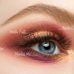 Hand applying vegan taupe eyeshadow with blending brush for a soft smoky eye look