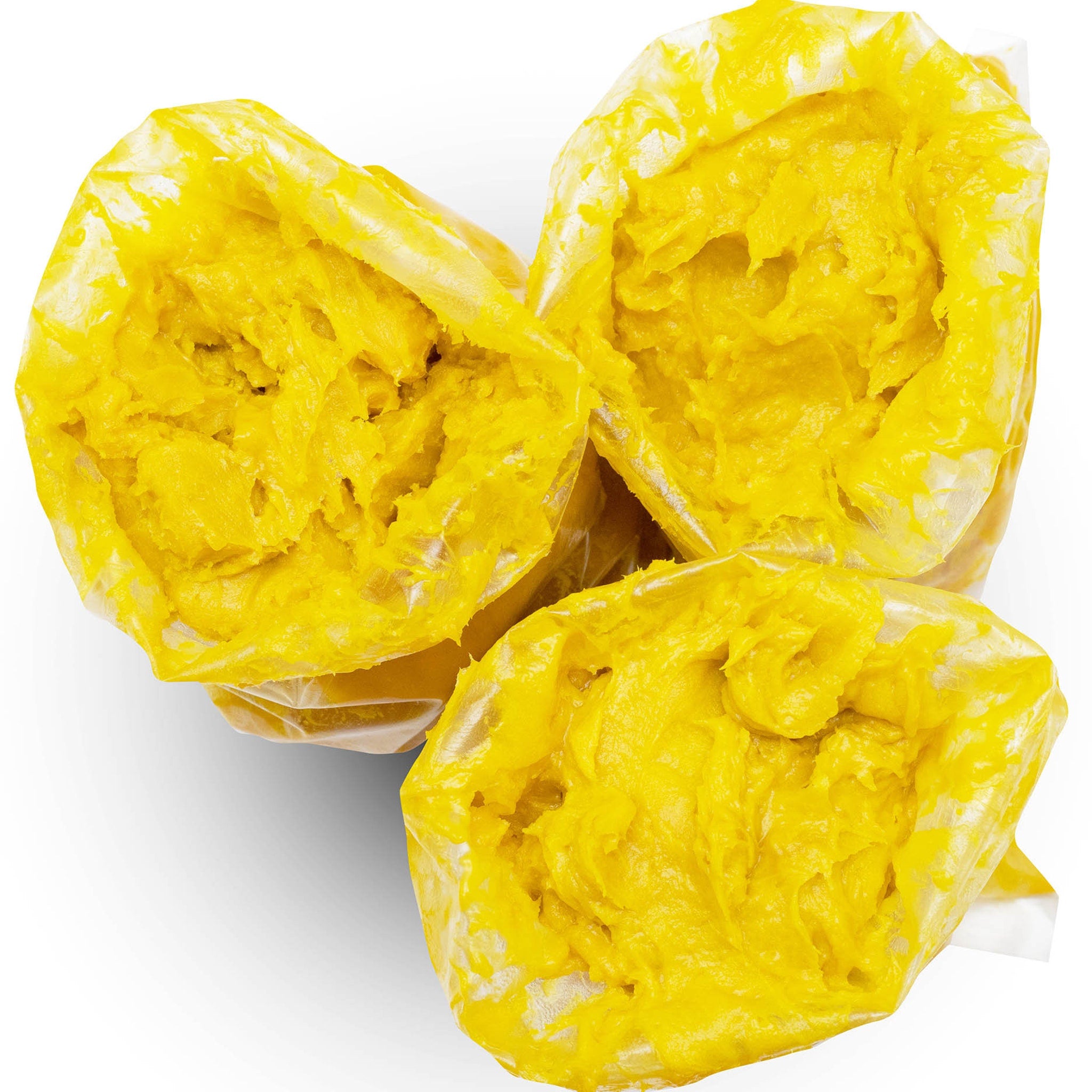 Yellow food product in clear plastic bags, showing texture and color