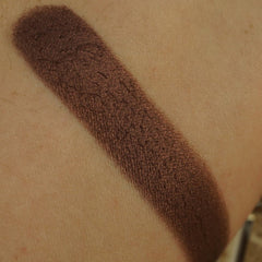 Side view of vegan chocolate brown shimmer eyeshadow pan showing pressed pigment texture and 26mm size