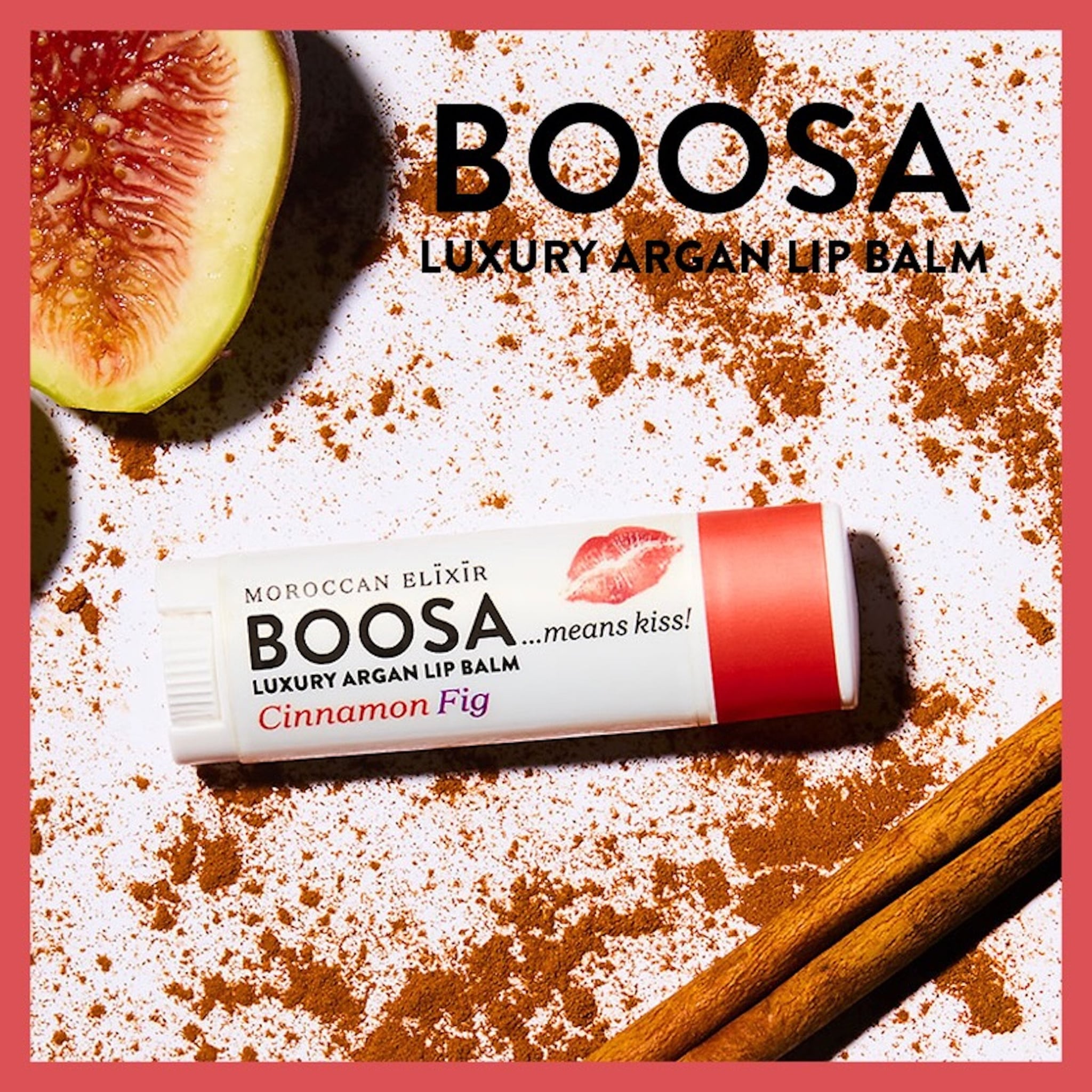 Lip balm product with white and red tube, BOOSA brand text, and cinnamon fig flavor label