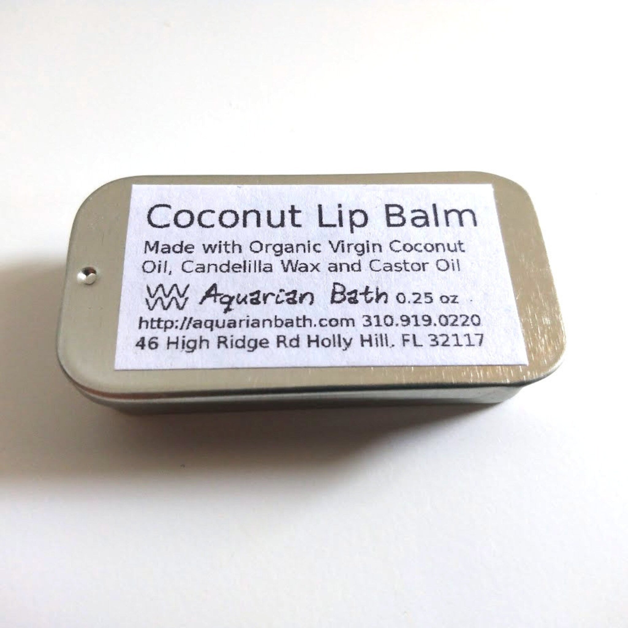 Coconut lip balm in metal tin with white label and Aquarian Bath text