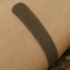 Close-up of matte pressed eyeshadow pan showing smooth, pigmented powder texture in a 26mm round compact