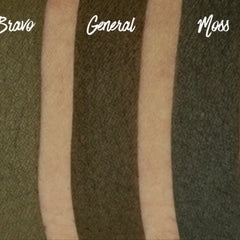 Side view of matte moss green eyeshadow pan showing pressed powder texture and 26mm circular shape