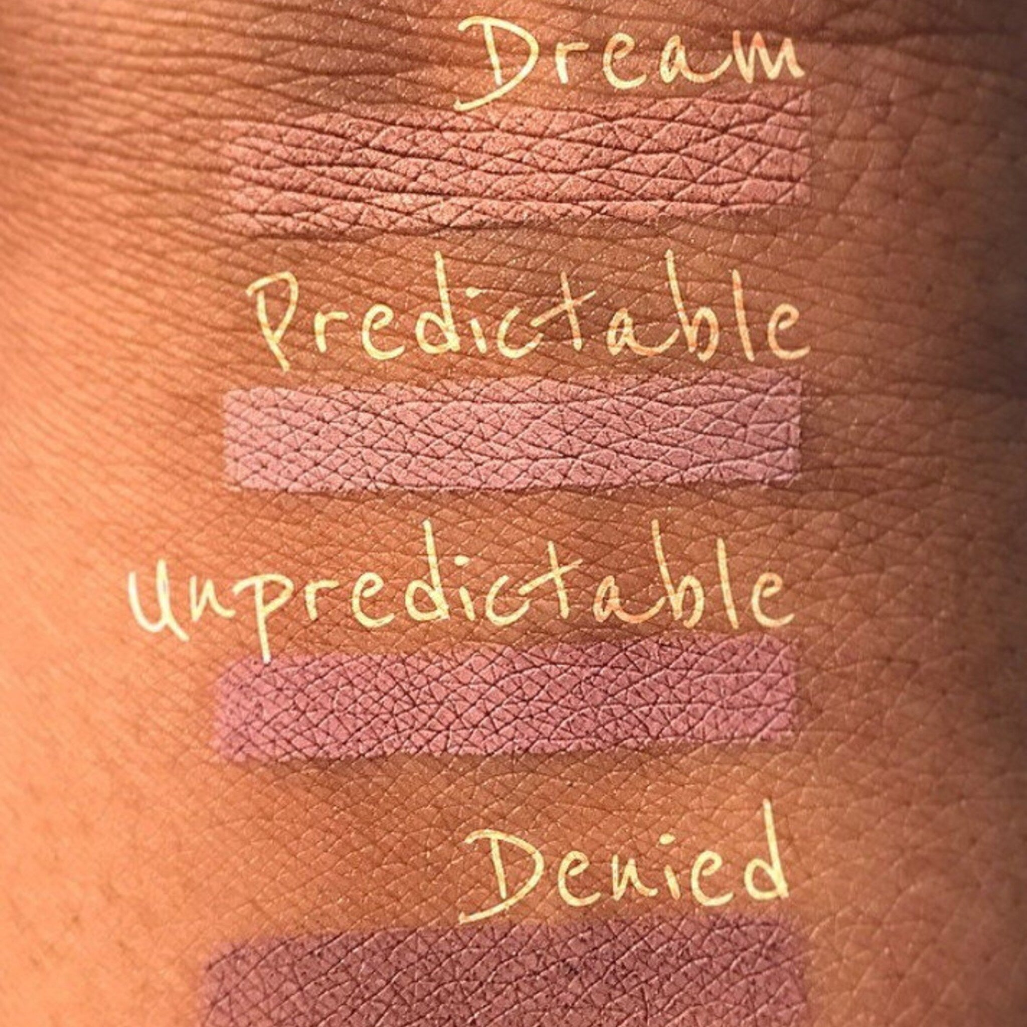Side view of matte regal eyeshadow pan showing pressed powder texture and 26mm circular shape, cruelty-free makeup