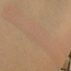 Close-up of matte pressed eyeshadow pan showing smooth pigment texture and 26mm circular compact