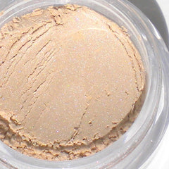 Side view of two 5g mineral eyeshadow jars showing matte taupe and shimmery champagne shades in round containers