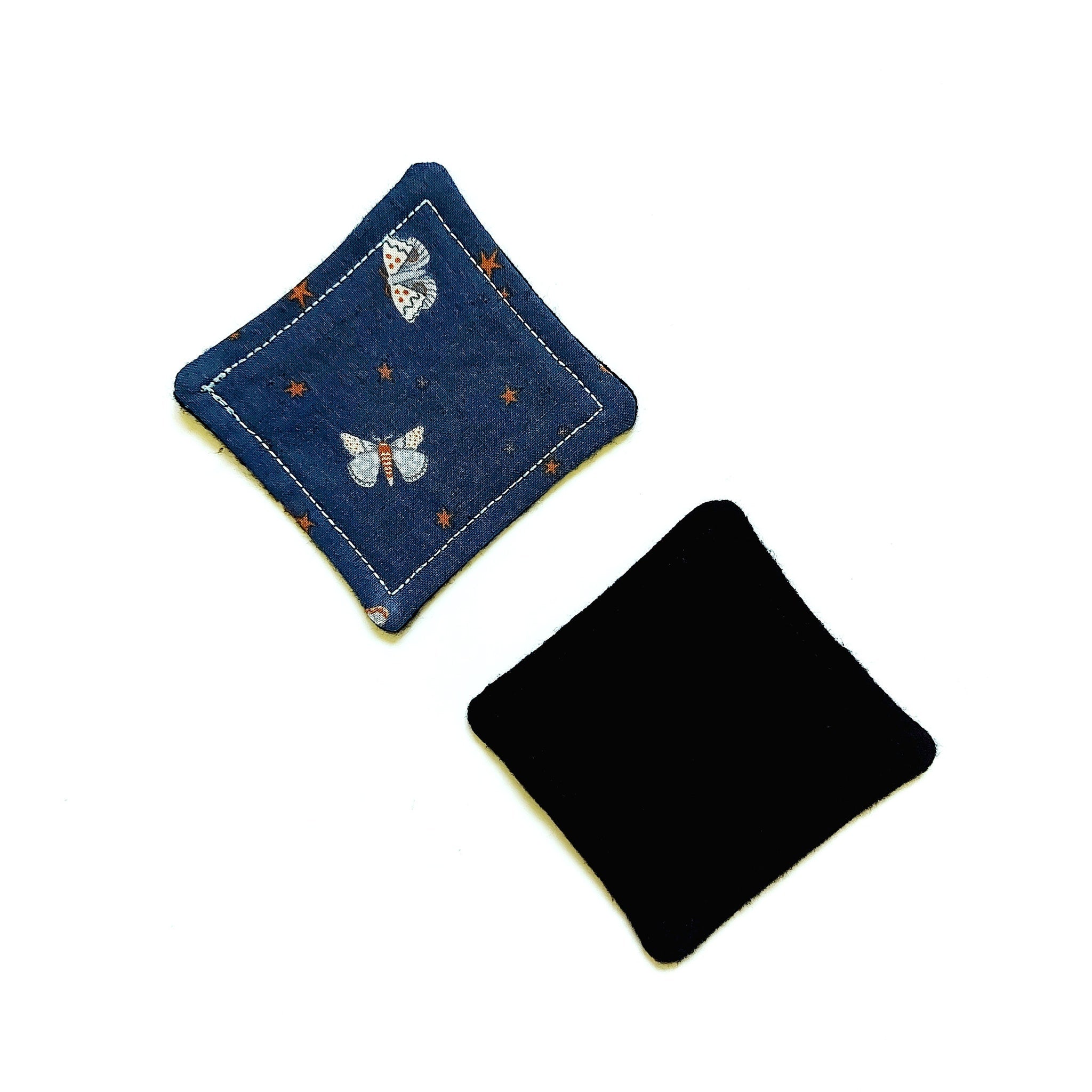 Coasters, blue patterned fabric with butterfly and star print, black felt backing