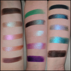 Eyeshadow swatches, various colors including green, purple, and brown, with shimmer and matte finishes on arm