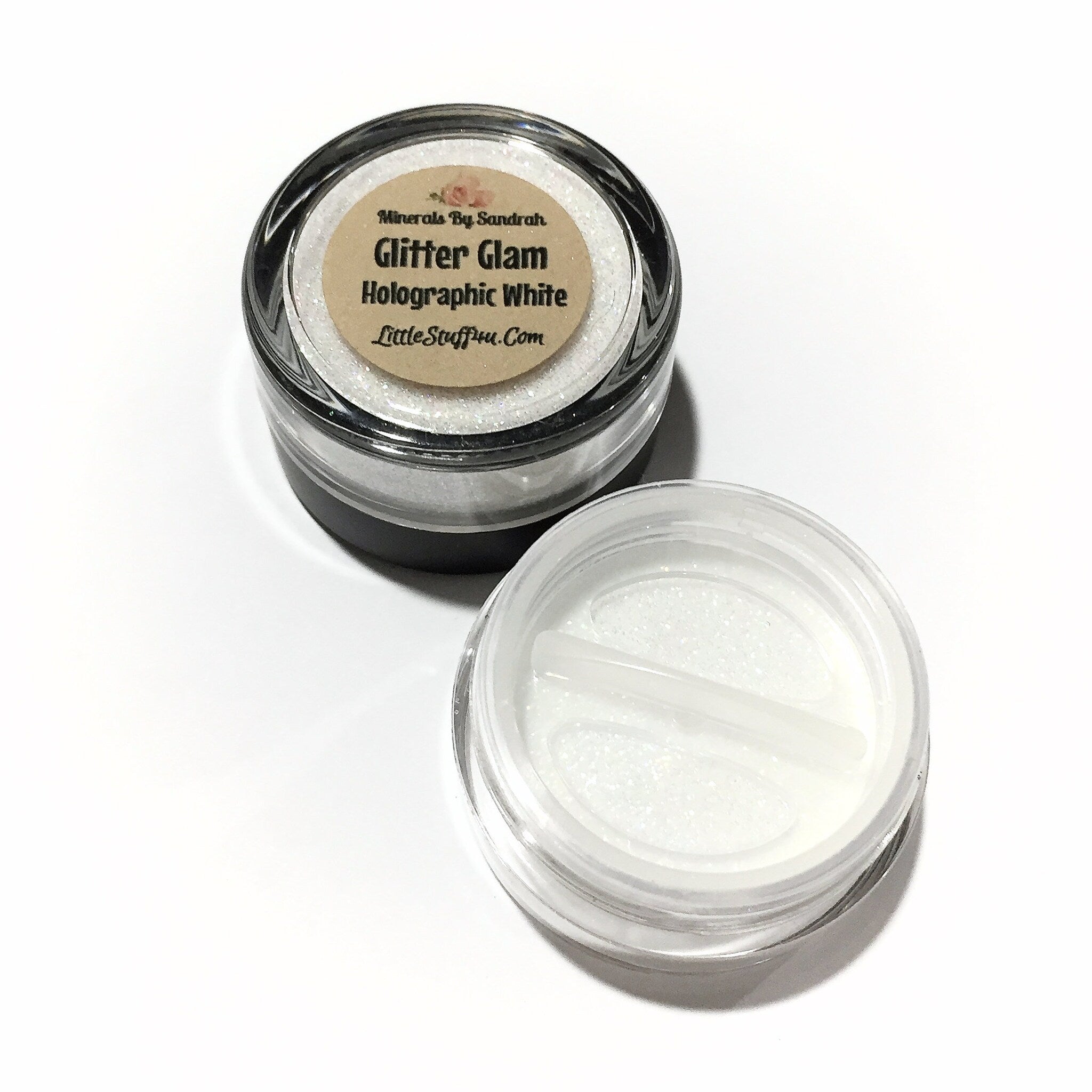 Glitter glue and highlighter set displayed on a sleek black tray with gold accents, showcasing the product packaging