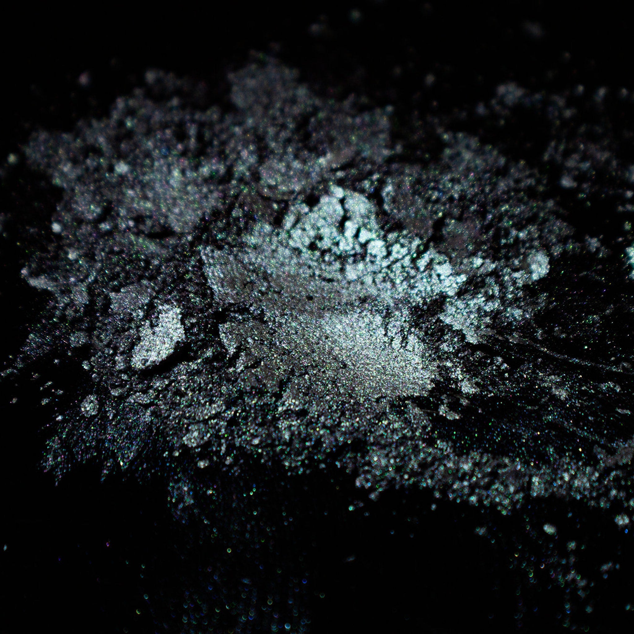 Side view of Grungy Blue to Purple Duochrome Eyeshadow pan showing shimmer shift at an angle