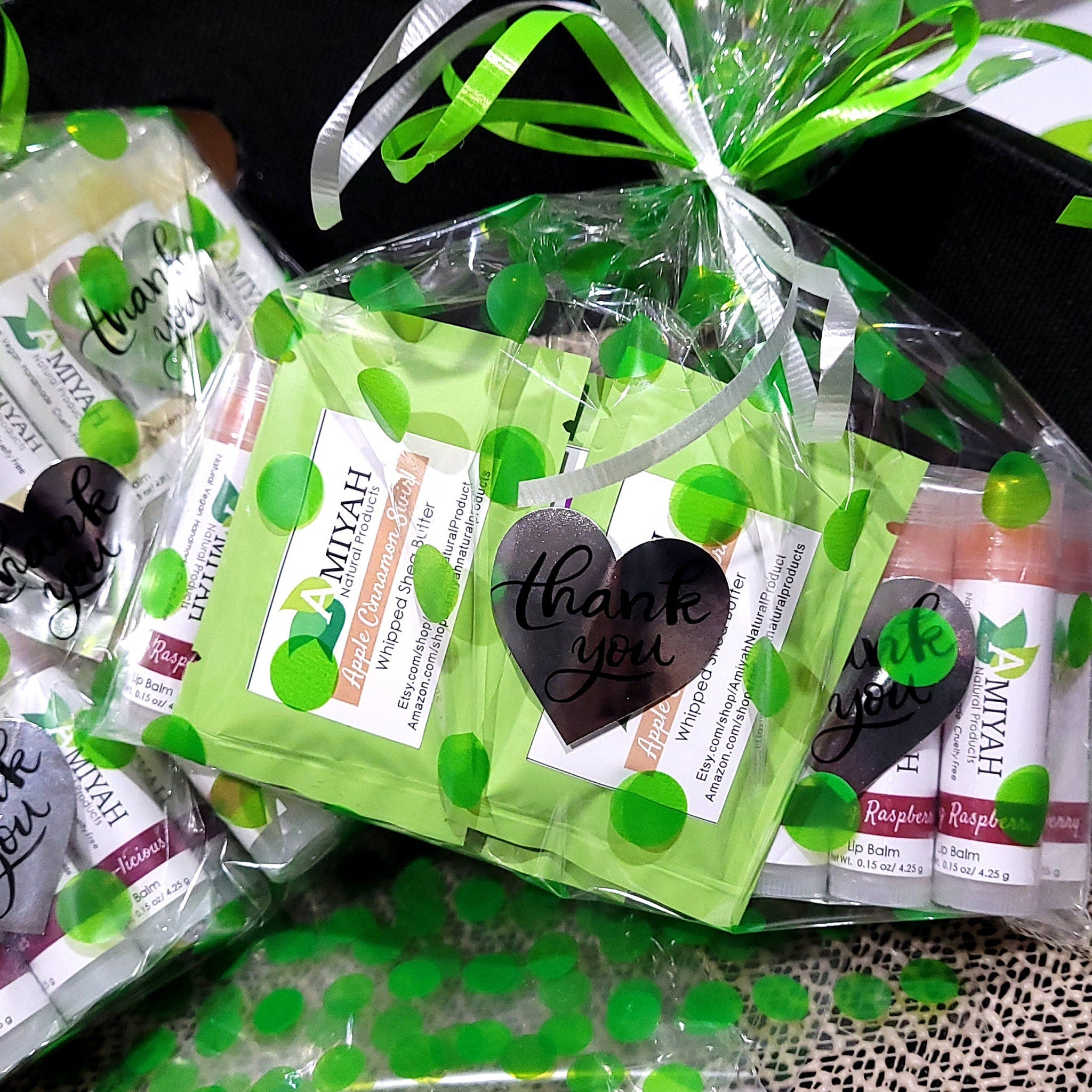 Gift basket with green and white ribbons, polka dot cellophane, and Amiyah Natural Products labels