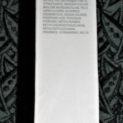 White product ingredient list with black patterned background and black side border