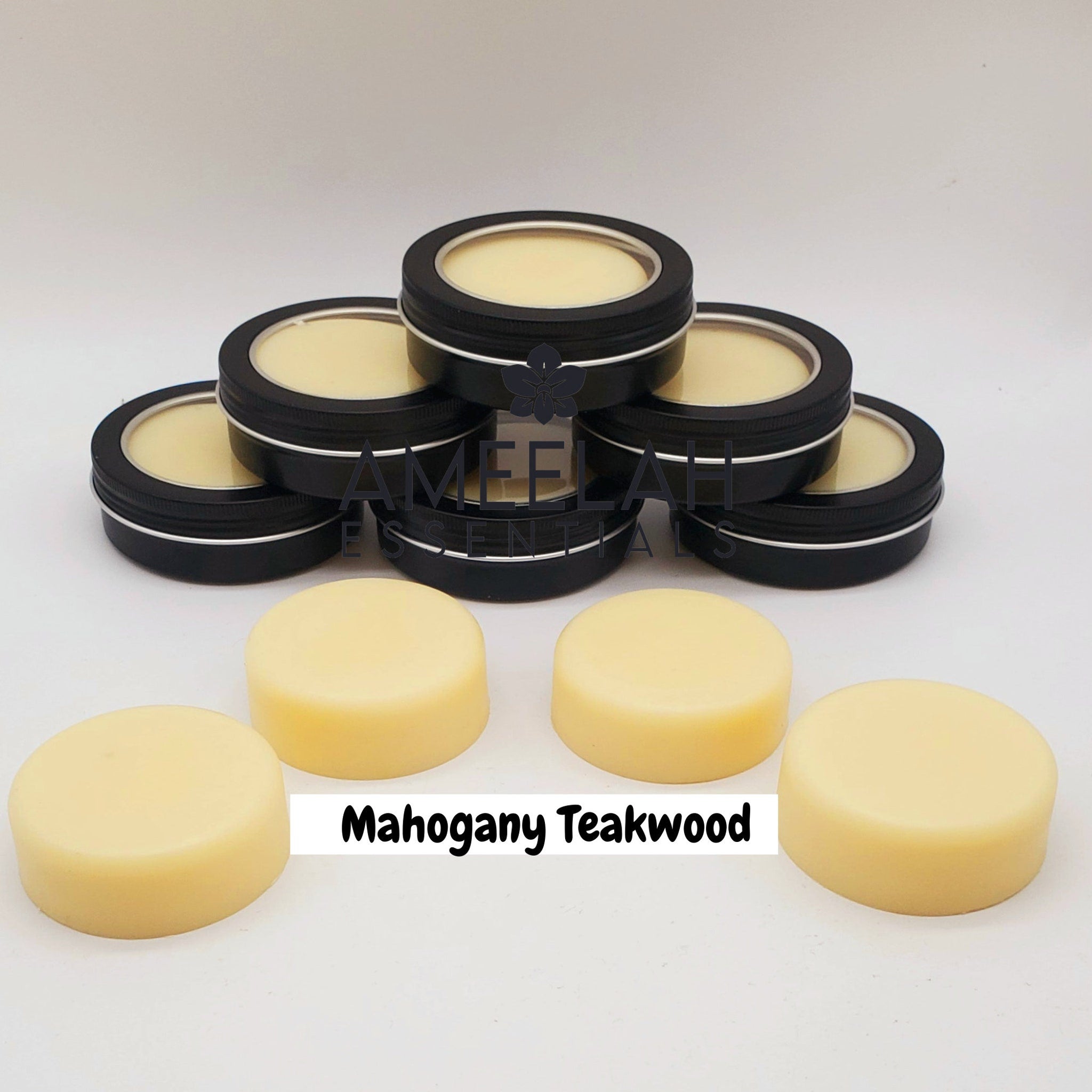 Stacked premium shea butter lotion bars in minimalist white packaging with gold accents