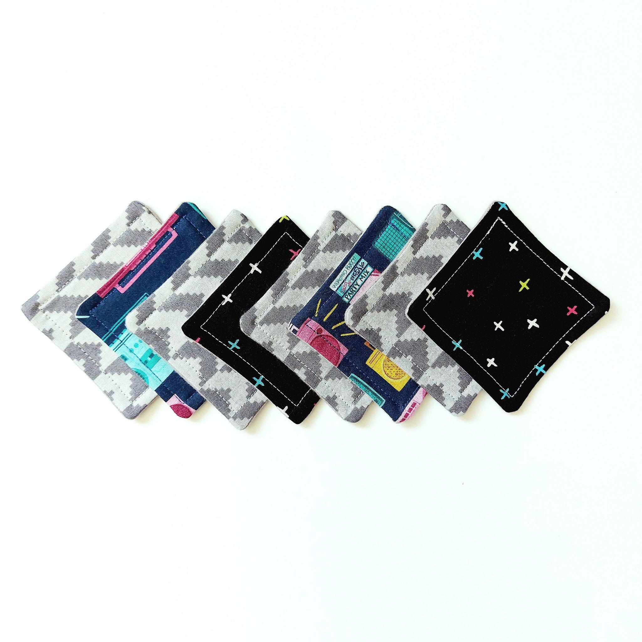 Coasters assorted colors and patterns, geometric and floral designs, square fabric