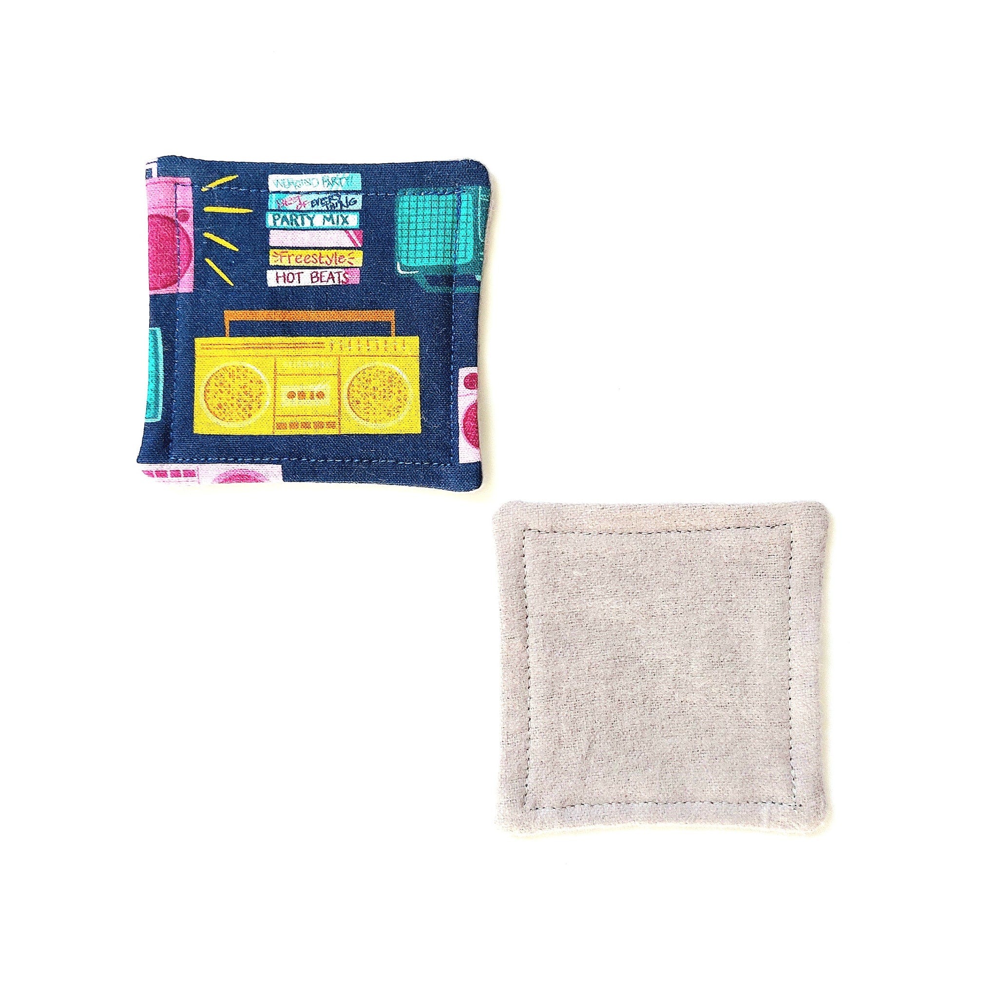 Coaster with navy, yellow, and pink boombox print, and light grey fabric backing