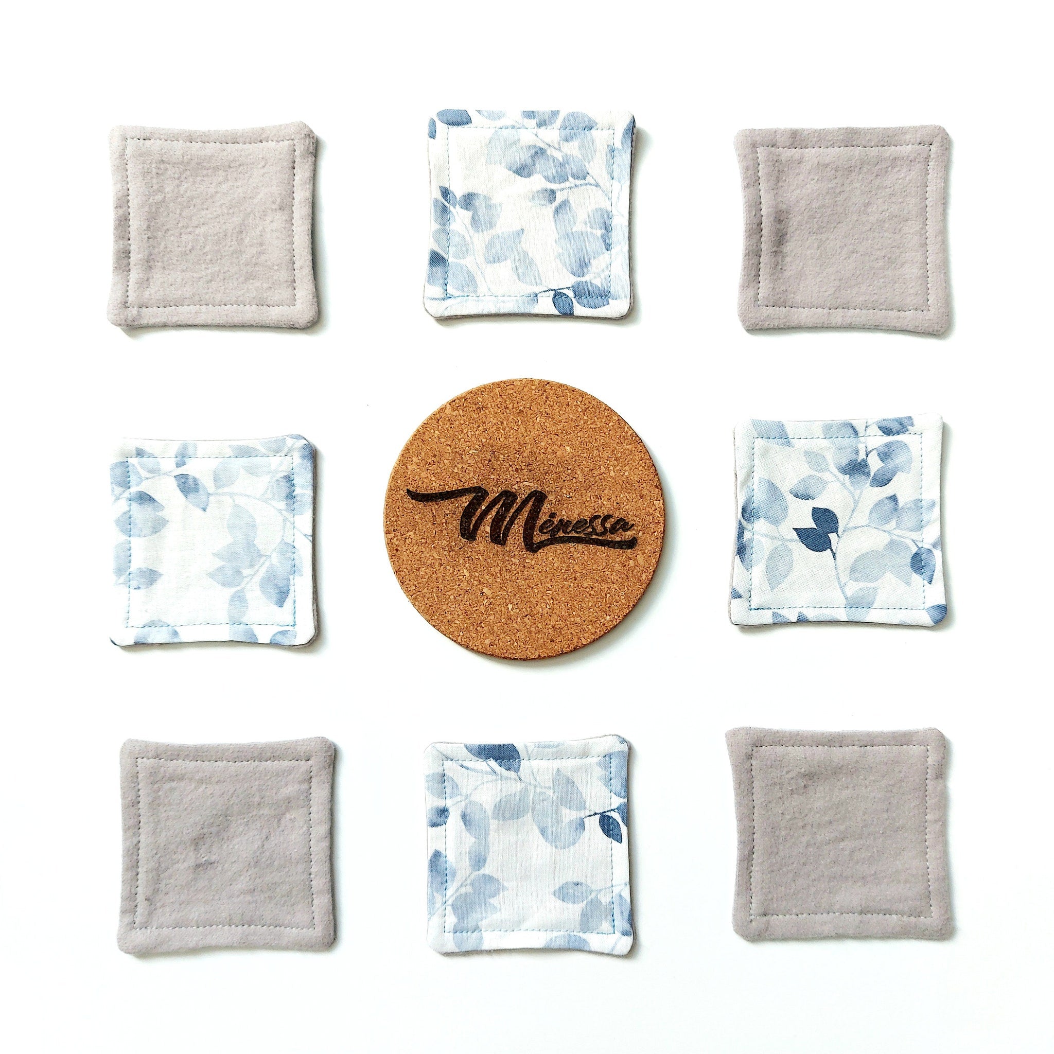 Reusable facial rounds in gray and blue floral pattern, with cork coaster and "Minessa" text