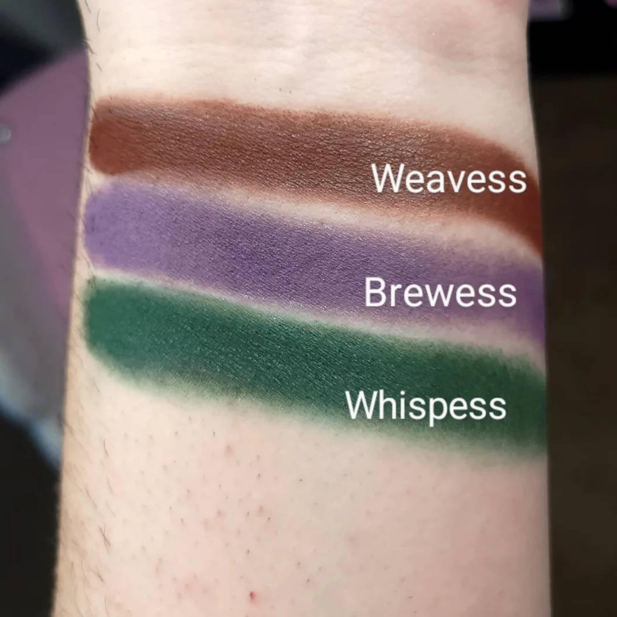 Eyeshadow swatches in brown, purple, and green shades on skin, with Weavess, Brewess, and Whisspess labels