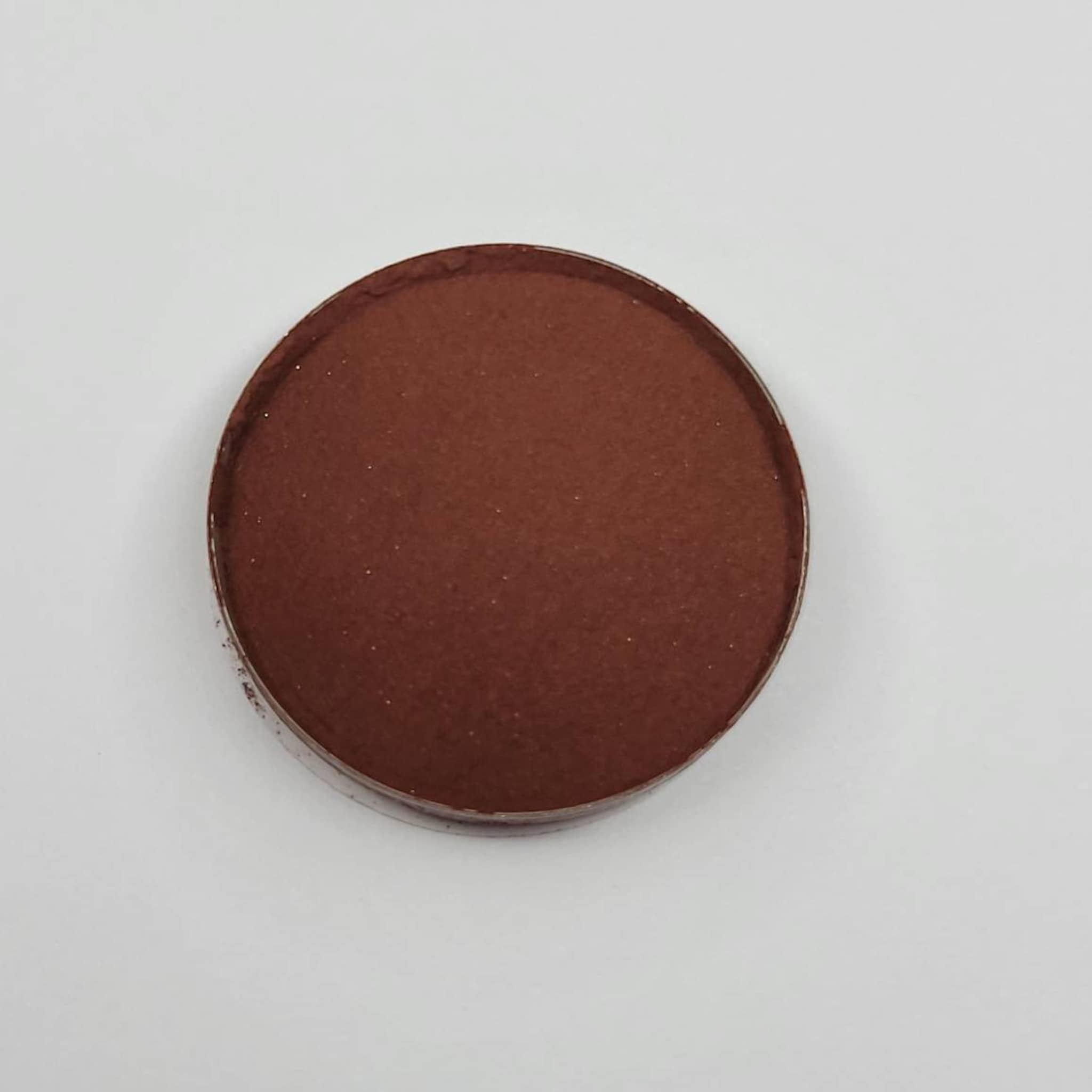Matte eyeshadow dark red compact, round with brown color and metallic rim