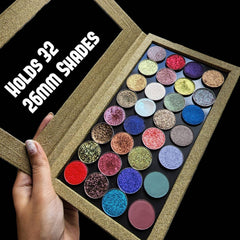 Close-up of multichrome pressed eyeshadow pans in sparkly golden glitter shades inside magnetic palette