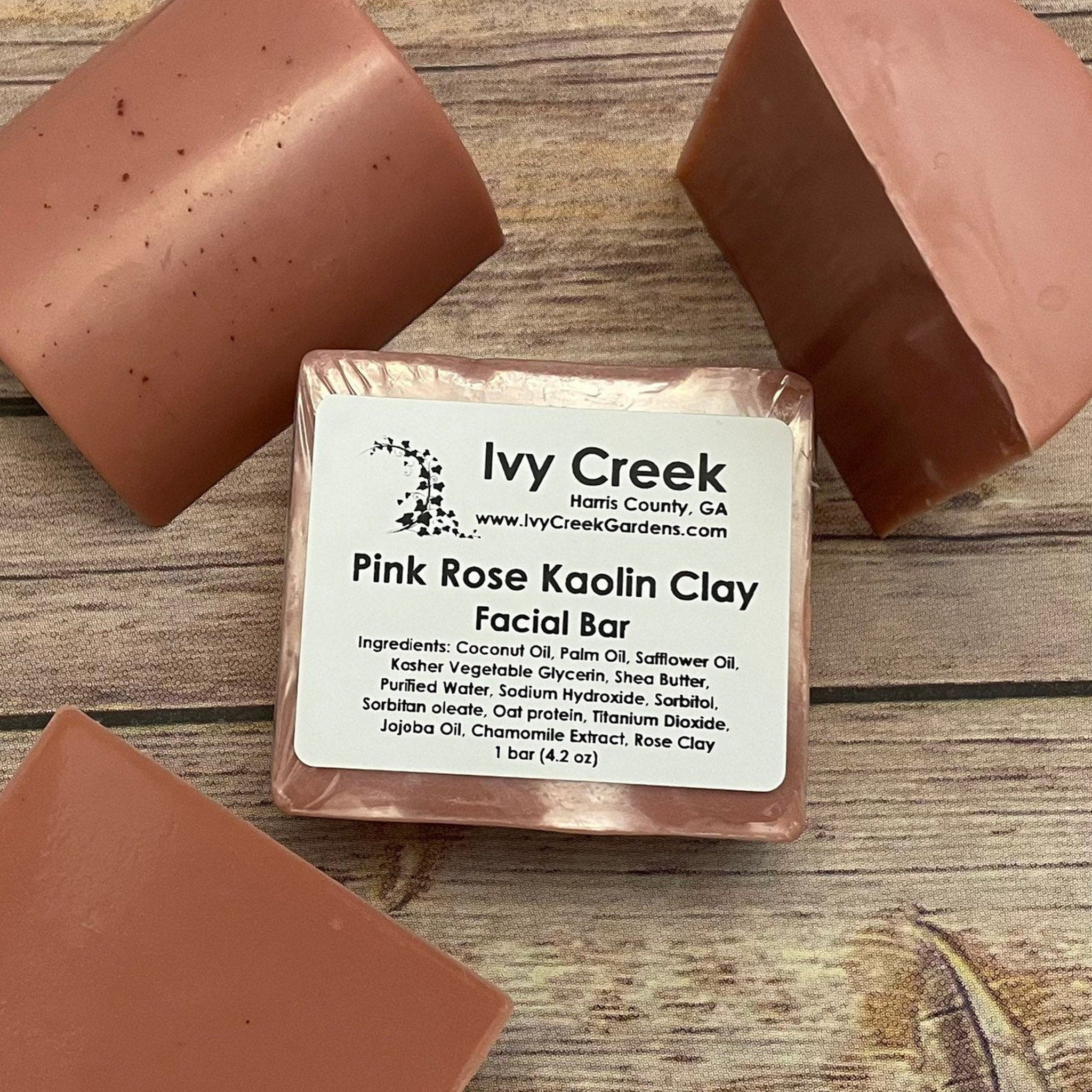 Pink Rose Kaolin Clay Facial Bar in pink, rectangular shape with visible Ivy Creek label on wood surface