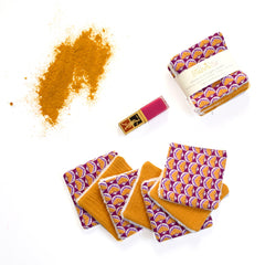 Reusable face wipes with purple and orange floral pattern, La Fourmi Elé branding, and yellow backing