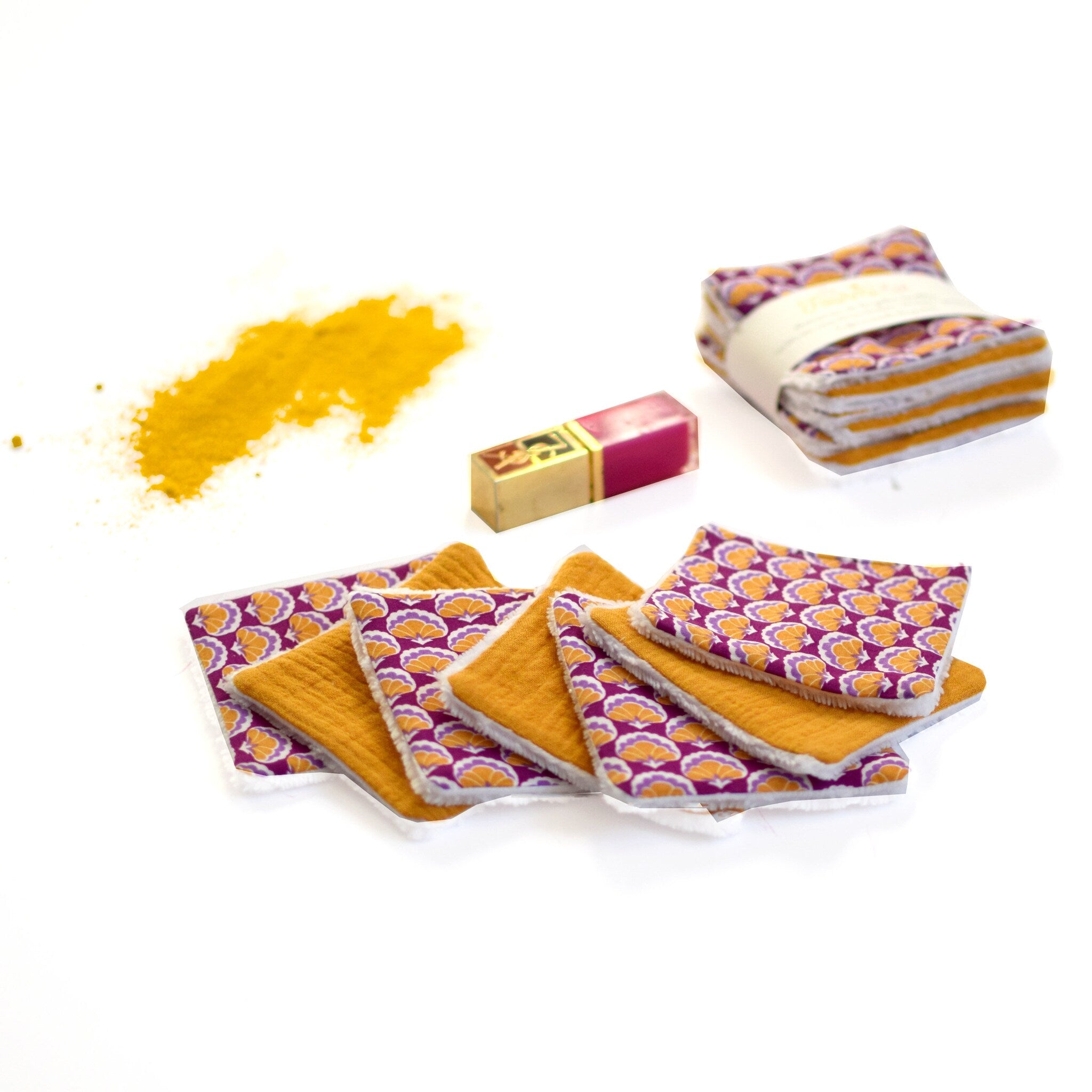 Reusable face cloths with orange and purple floral pattern, yellow center, and white trim