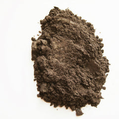 Close-up of warm cognac mineral eye shadow with rich, shimmery finish in compact case