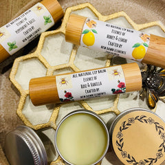 Lip balm tubes with bamboo, white labels, and floral illustrations, by New Dawn Elements