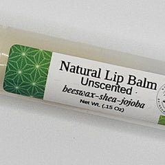 Lip balm tube with green geometric pattern label, white text, and beige tube