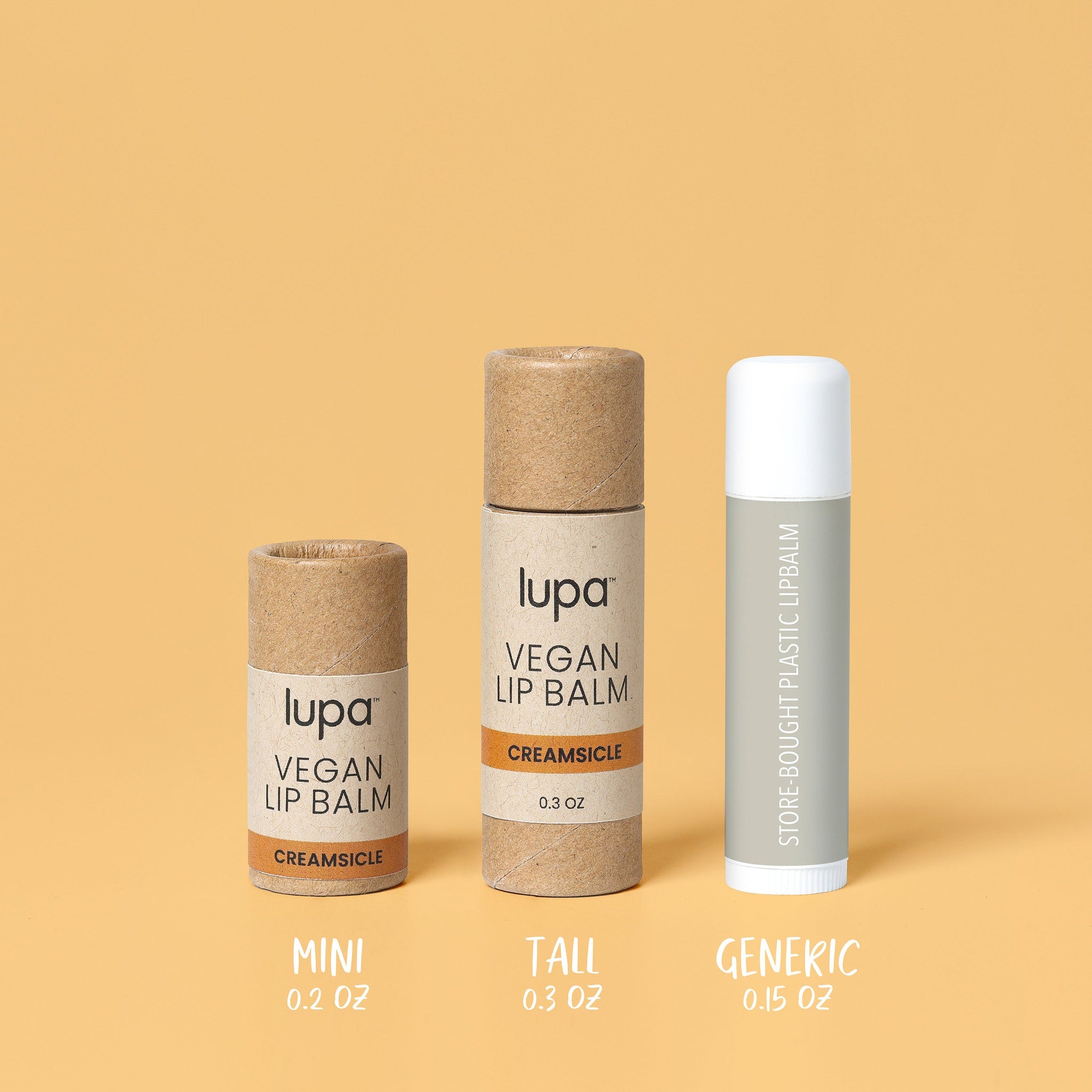 Vegan lip balm tubes in brown cardboard, white and gray plastic, and Lupa branding shown