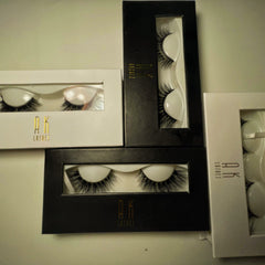 False eyelashes black mink style with AK Lashes branding in boxes