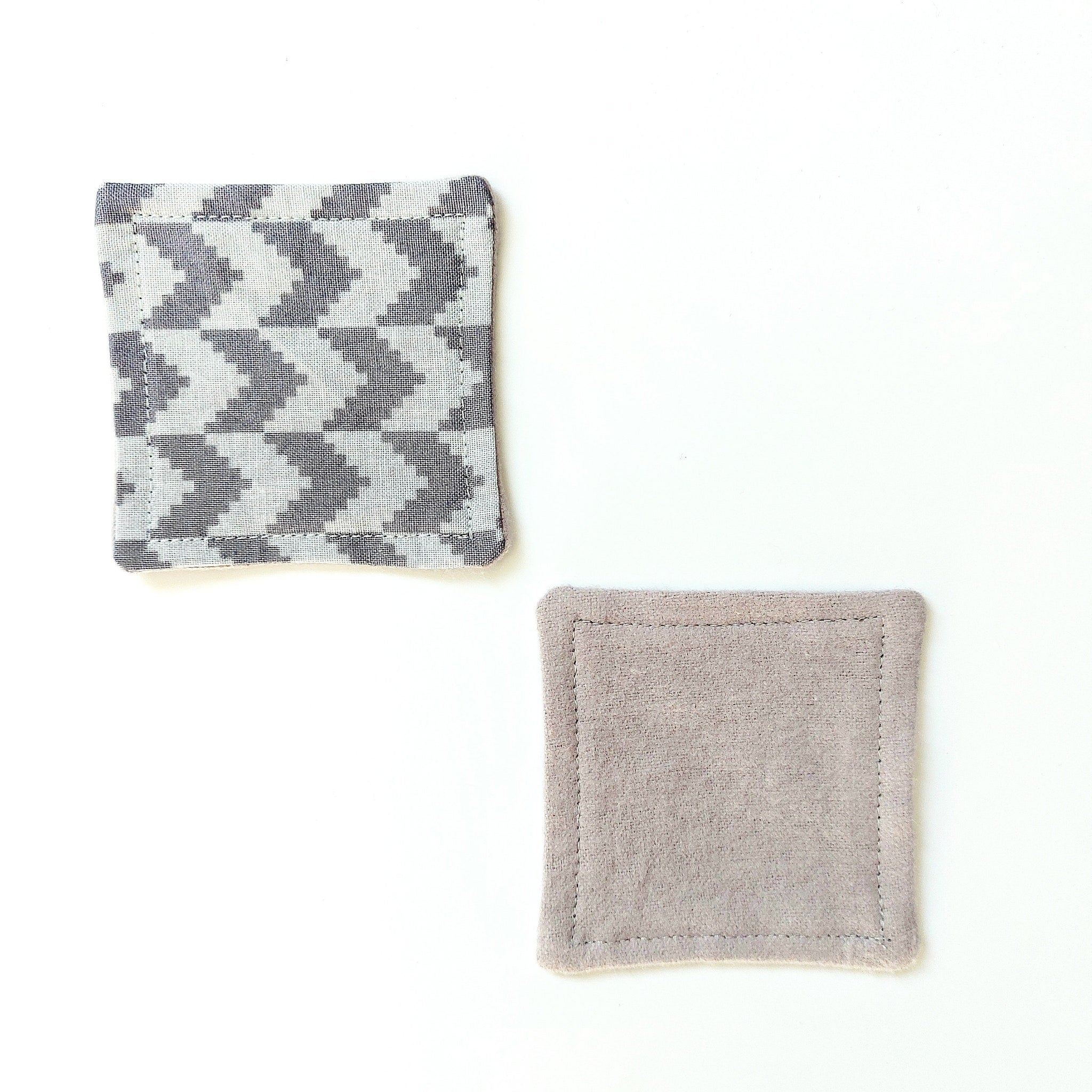 Coasters, gray fabric with chevron pattern and solid gray with stitched edges