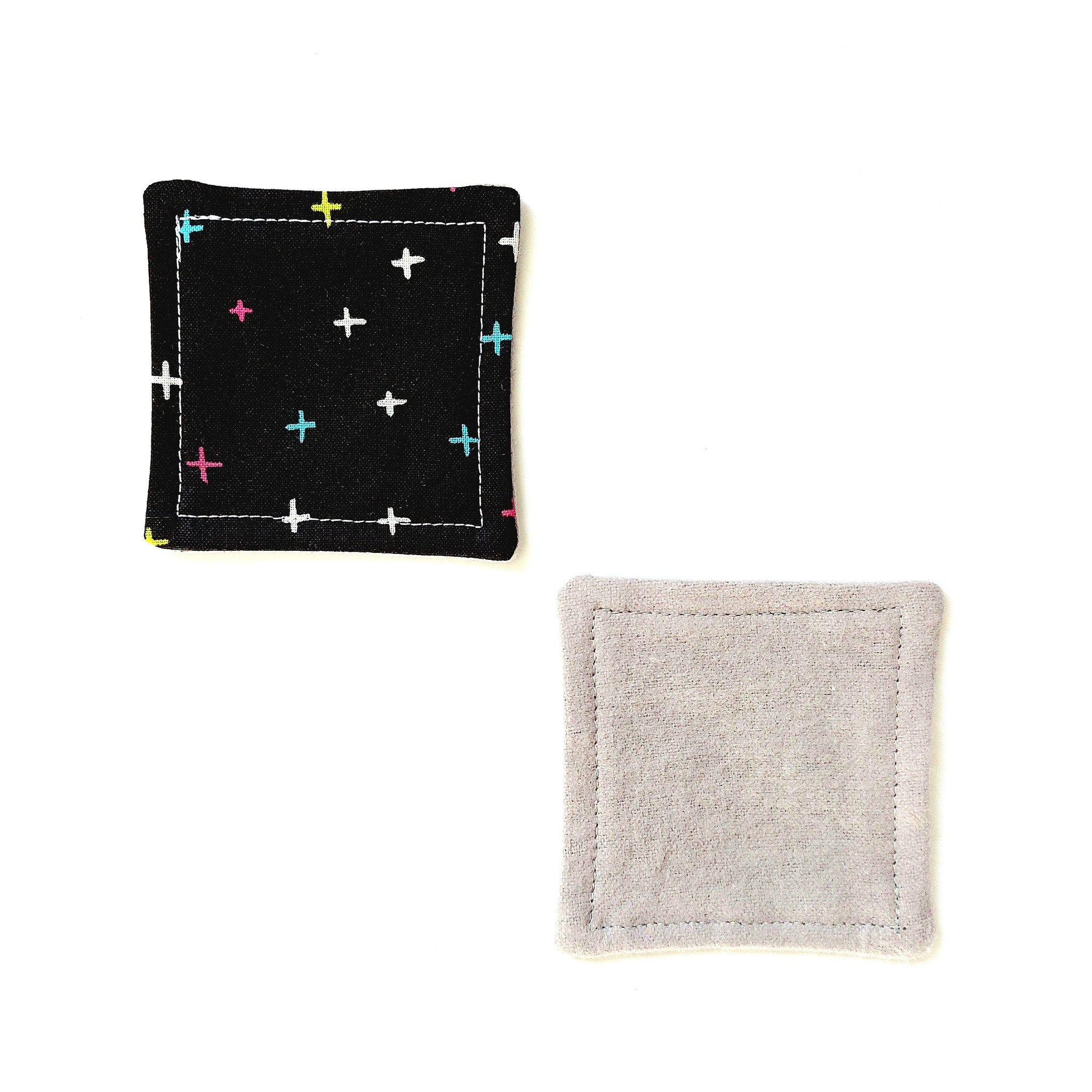 Coasters black fabric with plus pattern and gray fabric square with stitched edges