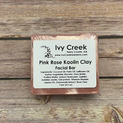 Facial bar of pink color, wrapped, with Ivy Creek label on wood background