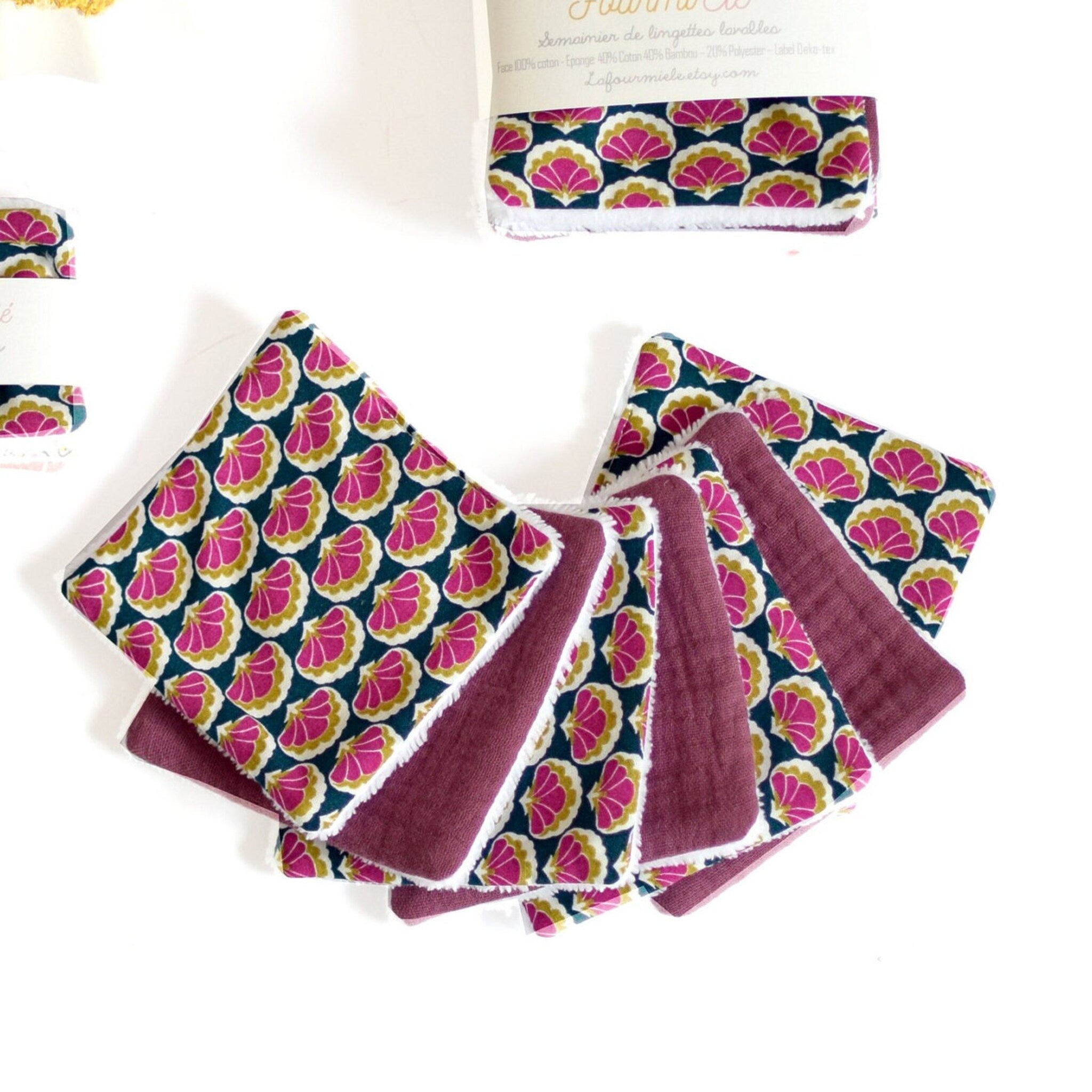 Reusable wipes with floral pattern, teal and pink fabric, and white border detail